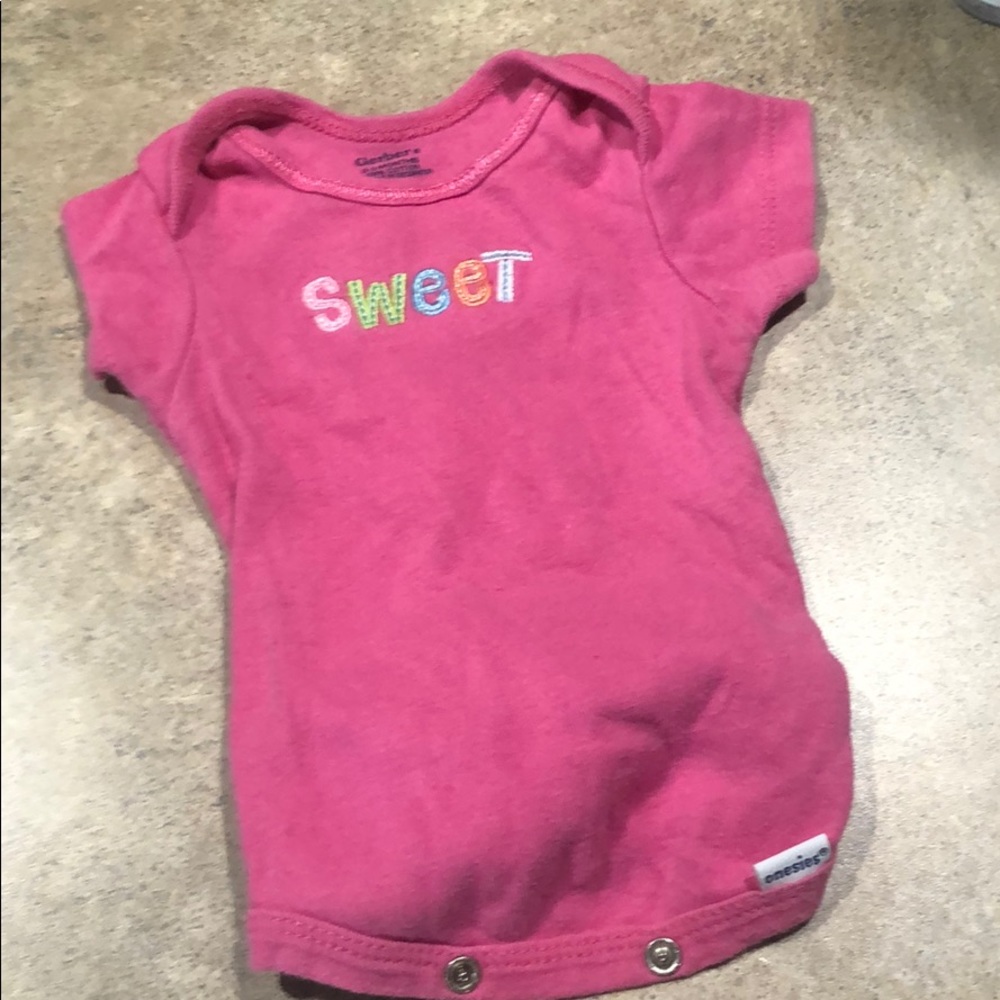 Hot pink onsie that says sweet